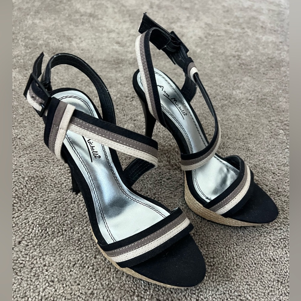 Brand new. Anne Michelle stiletto heels. Black with tan stripes. Size 7.